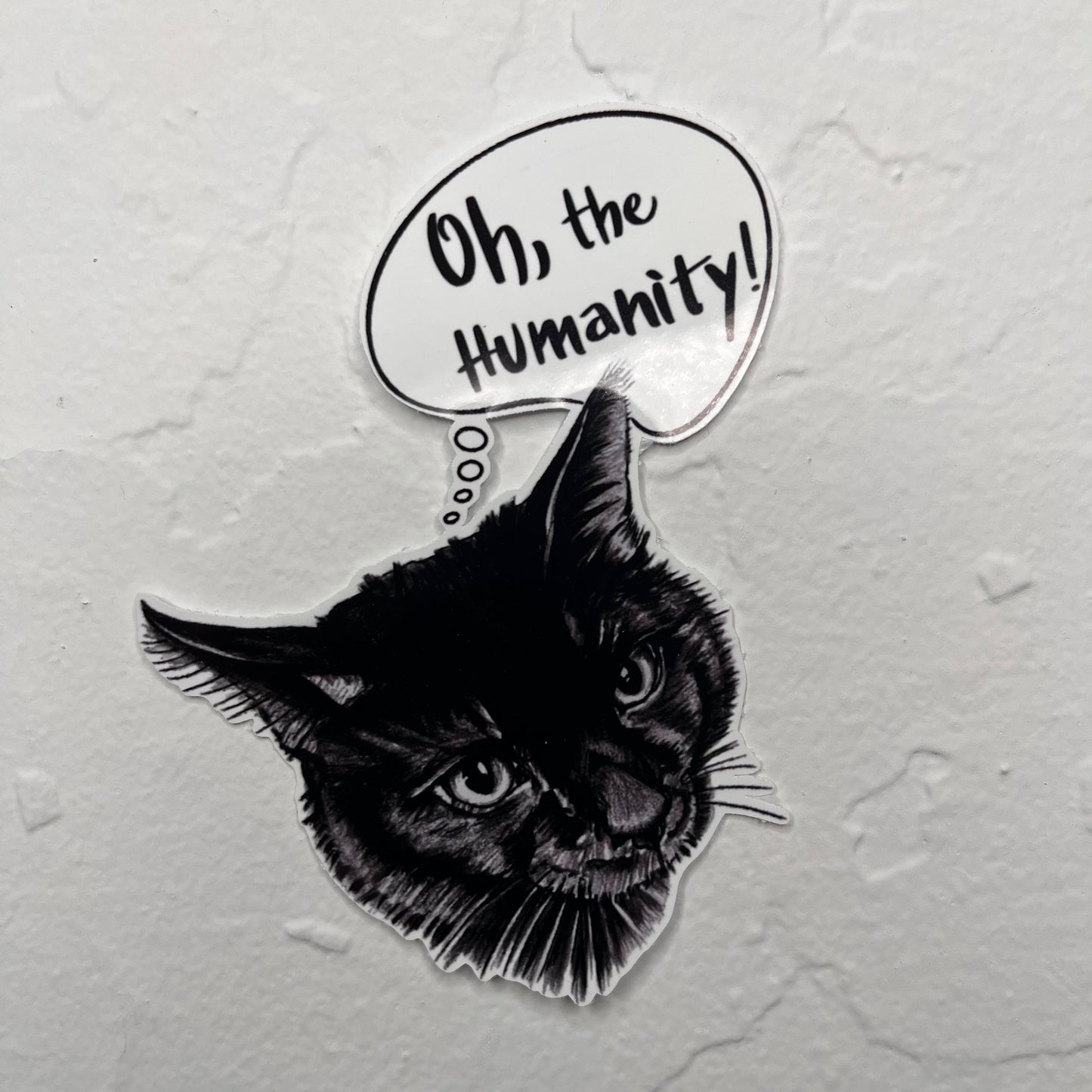 Black cat illustration with a speech bubble saying 'Oh, the Humanity!' on a gray background