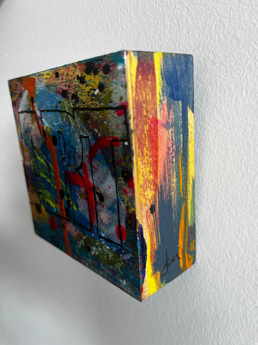 Colorful abstract art piece on a textured white background