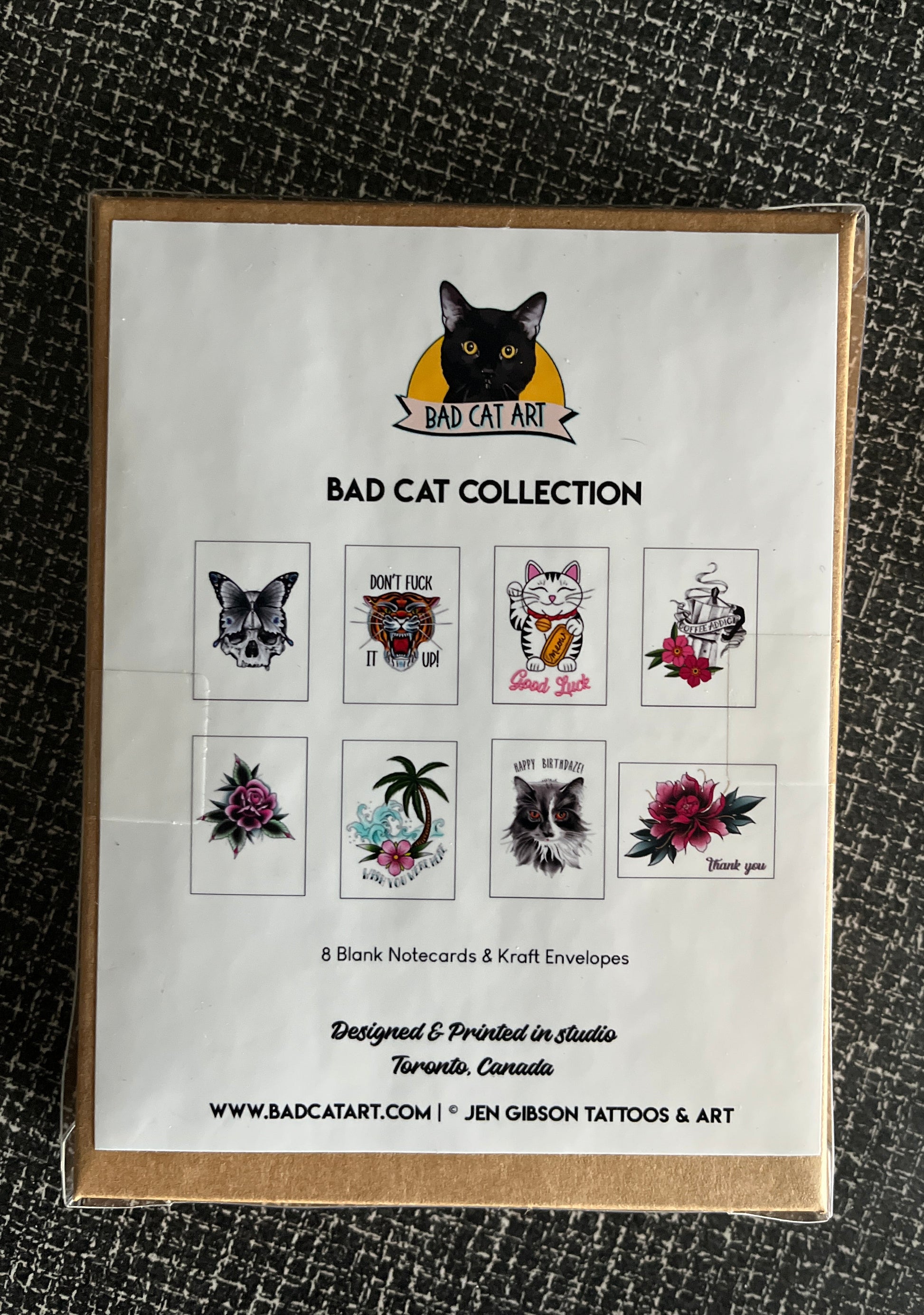Packaging of Bad Cat Collection card set  on a textured black surface