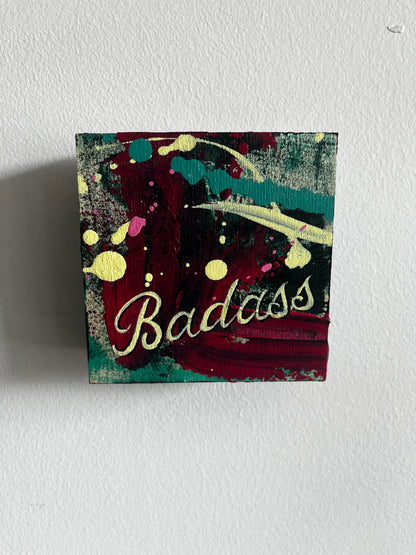 Colourful artwork with 'Badass' text on a textured white background