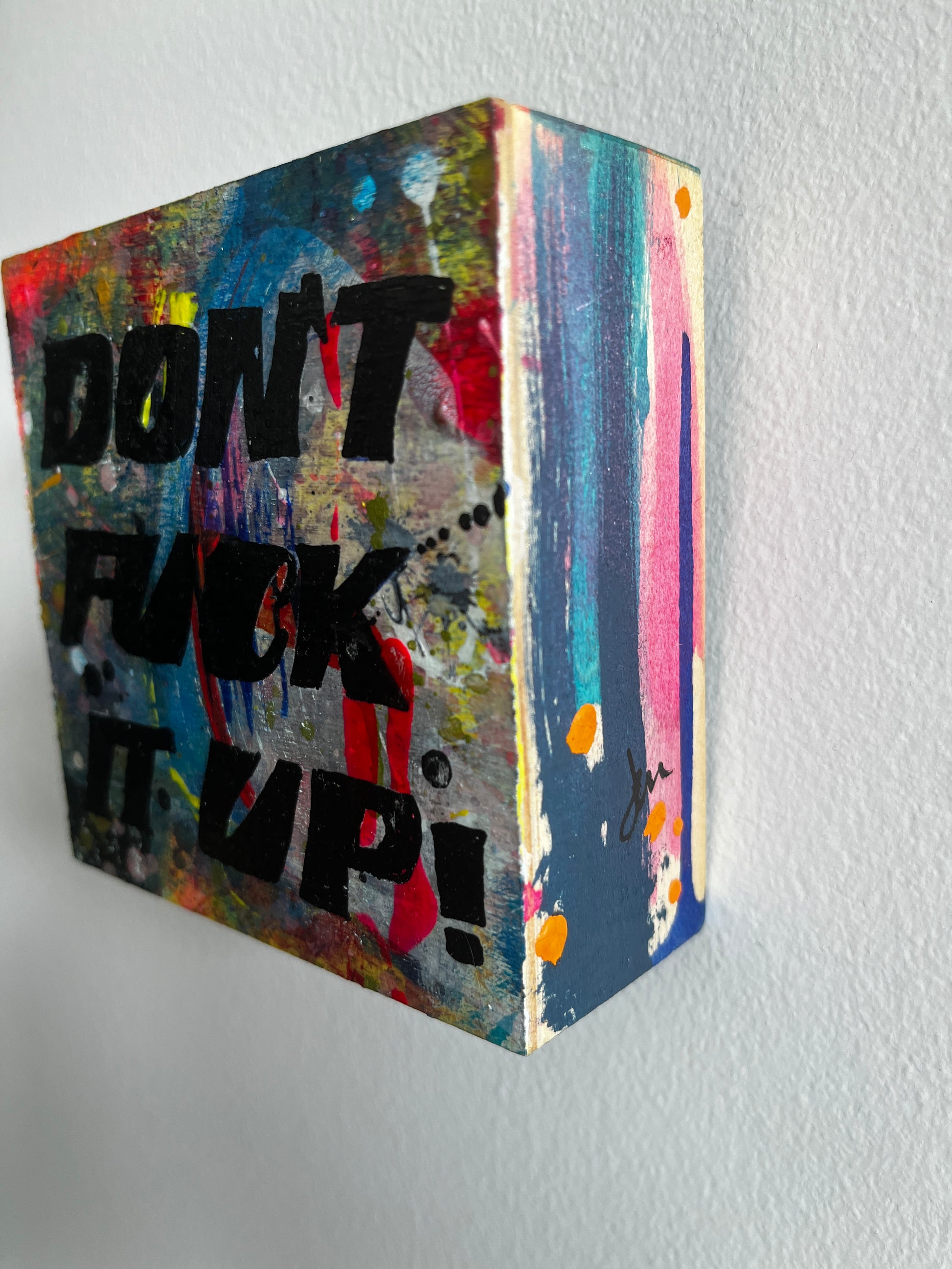 Colorful abstract art with text on a grey background