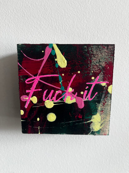 Abstract painting with pink and yellow elements on a textured white wall