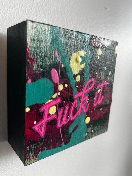 Decorative painting with colorful design and text on a white surface