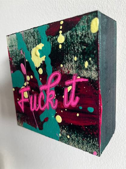 Colorful block with 'F*** it' text on a white background