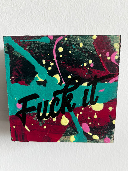 Abstract art piece with colorful splashes and text on a white background