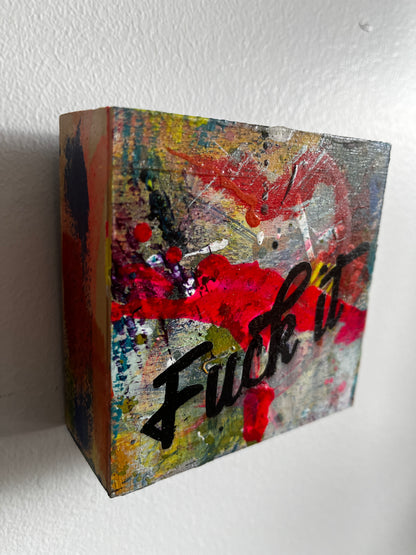 Colorful textured cube with abstract design on a white background