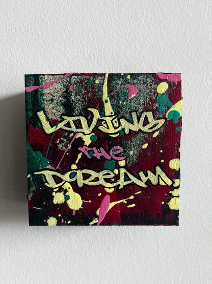 Abstract artwork with colorful splashes and text on a textured white background