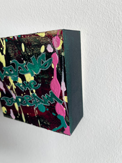 Colorful rectangular box with abstract design and text on a white background