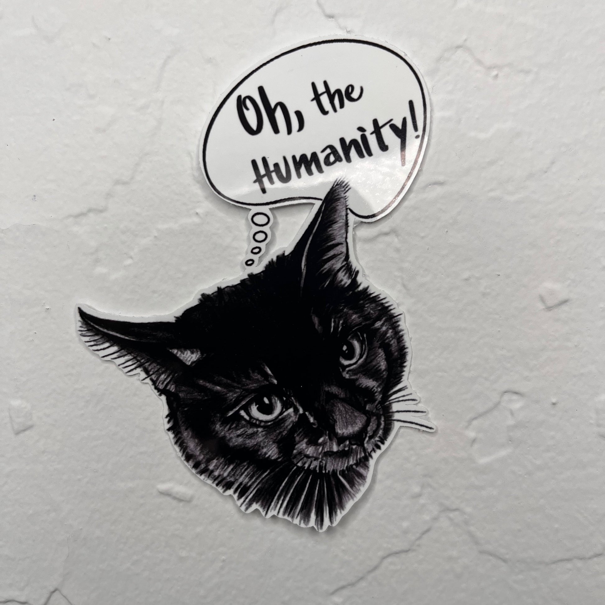 Glossy sticker of a black cat with a thought bubble saying Oh, the Humanity