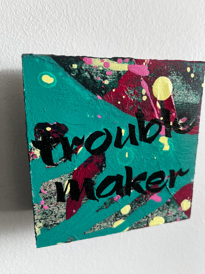 Colorful abstract painting with text on a textured white background