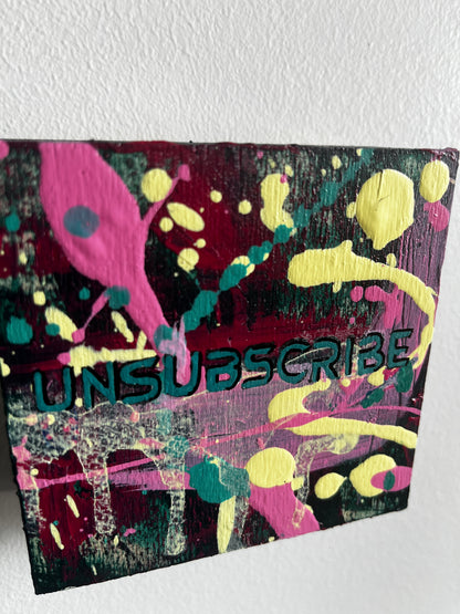 Colorful abstract poster with splashes and 'Unsubscribe' text on a white background