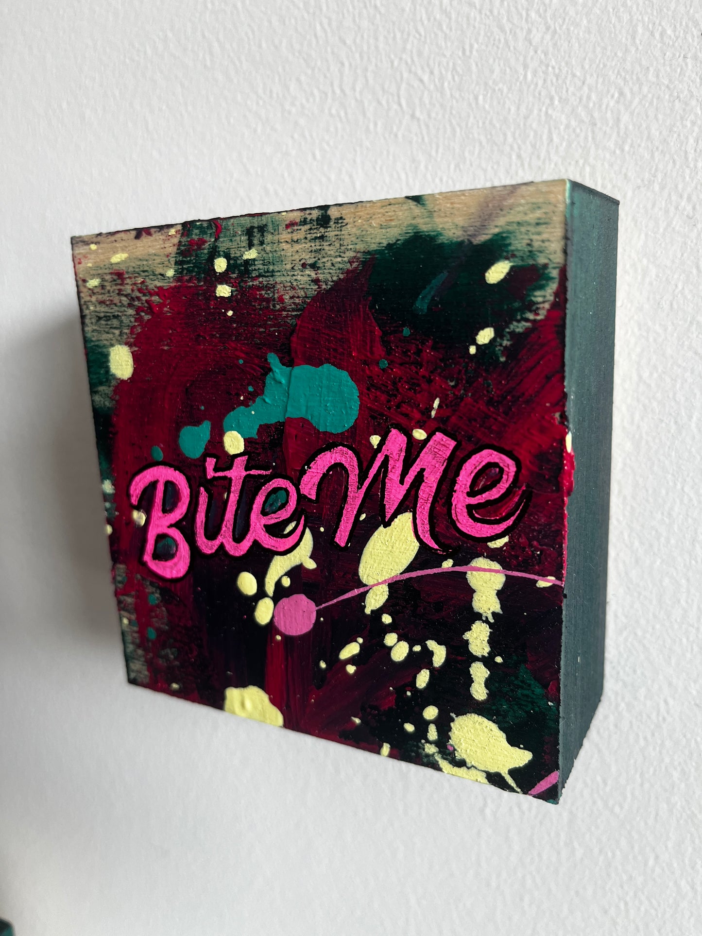 Decorative box with colorful design and text on a white background