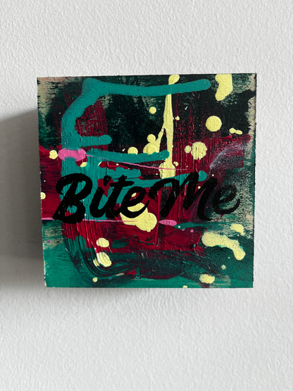 Abstract painting with splashes of color on a textured wall