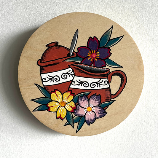 Painting with florals and ceramic creamer and sugar set design on a white background