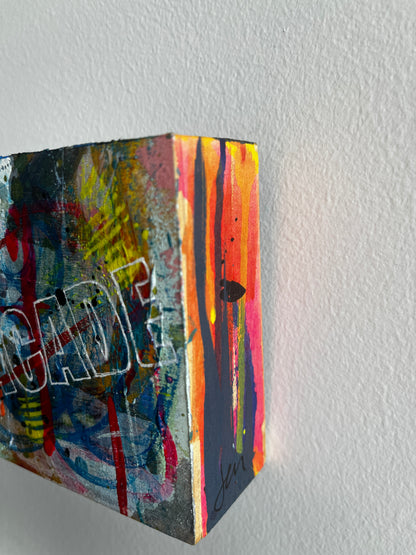 Colorful abstract art on a textured wall