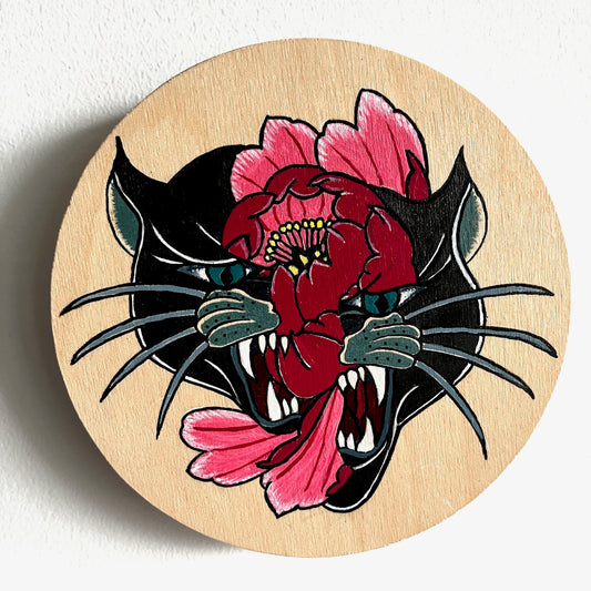 Wooden painting with a tattoo-style design of a panther and pink flower on a white background